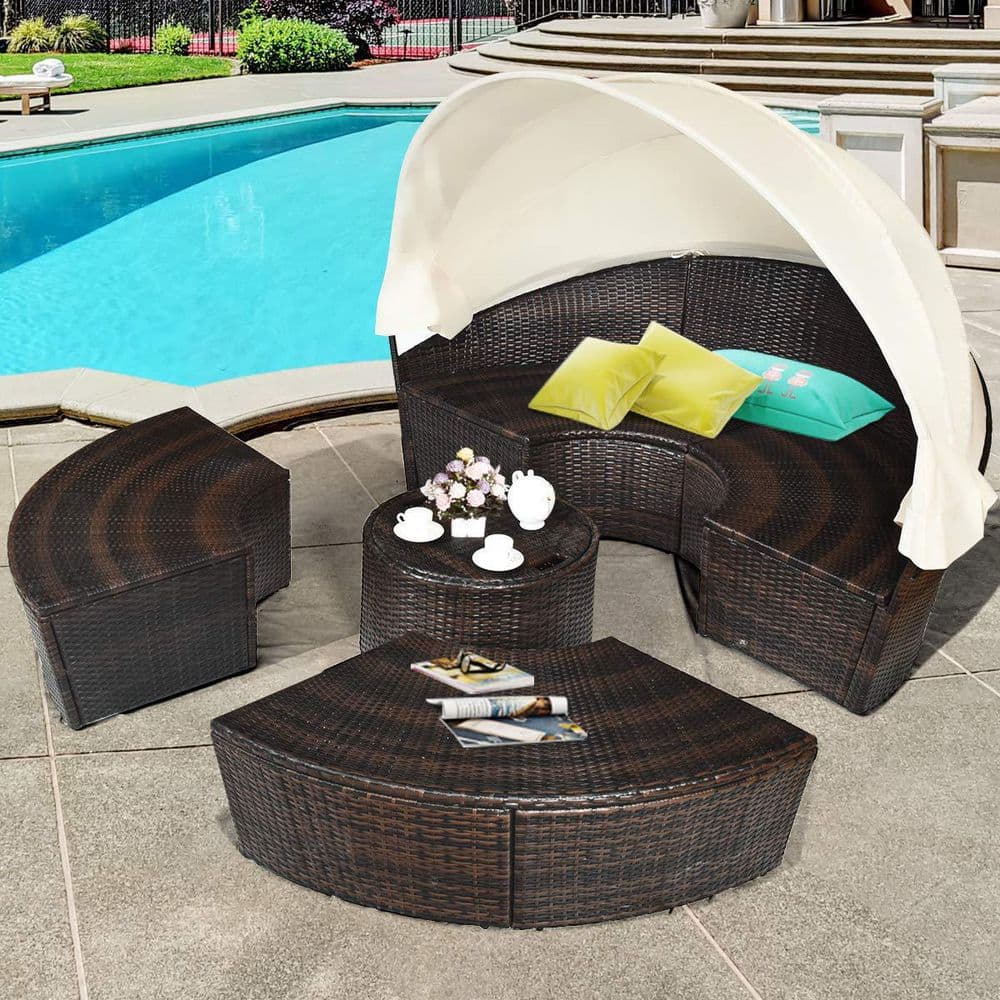 Brown Wicker Outdoor Patio Day Bed with White Cushions and Canopy