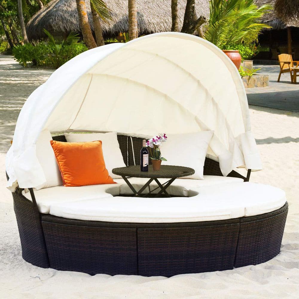Brown Wicker Outdoor Patio Day Bed with White Cushions and Canopy