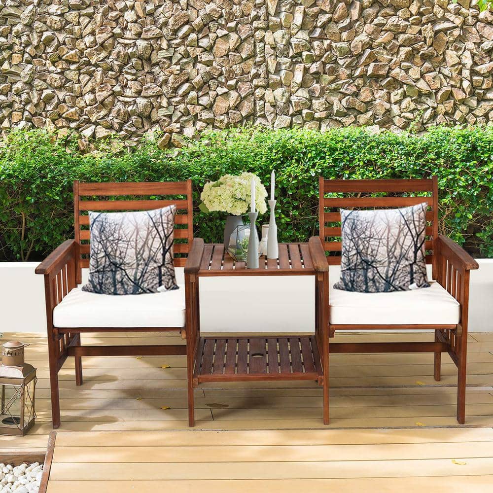 Brown Acacia Wood Outdoor Loveseat with Table and White Cushions