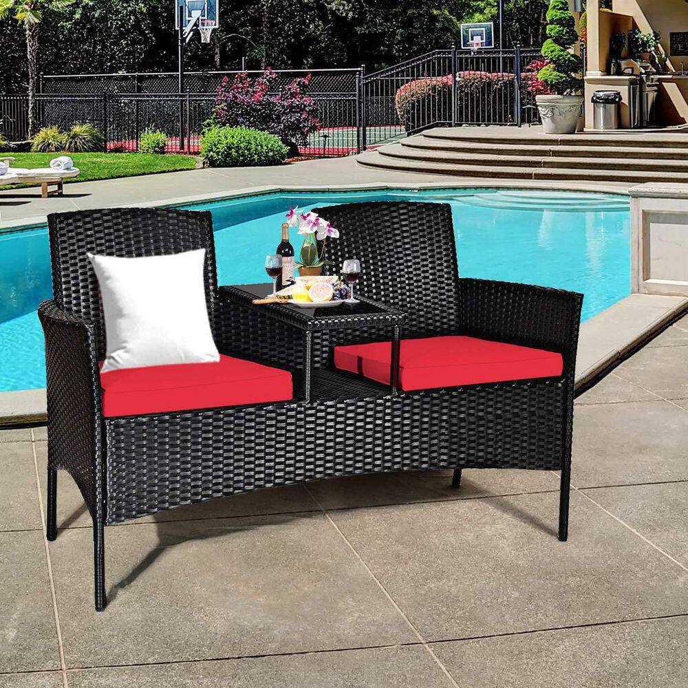 Black Wicker Outdoor Loveseat with Red Cushions and Center Tea Table