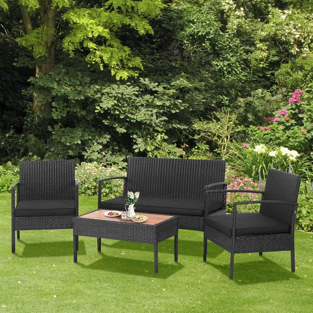 4-Piece Wicker Patio Conversation Seating Set with Wooden Tabletop and Black Cushions